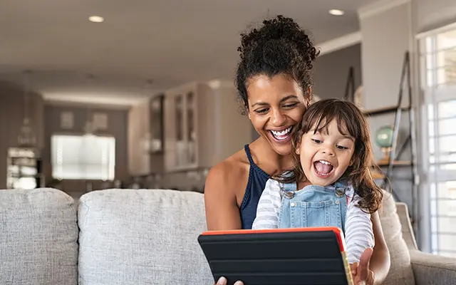 Woman and child looking at a mobile device