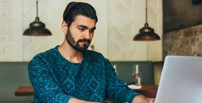 Man typing on laptop