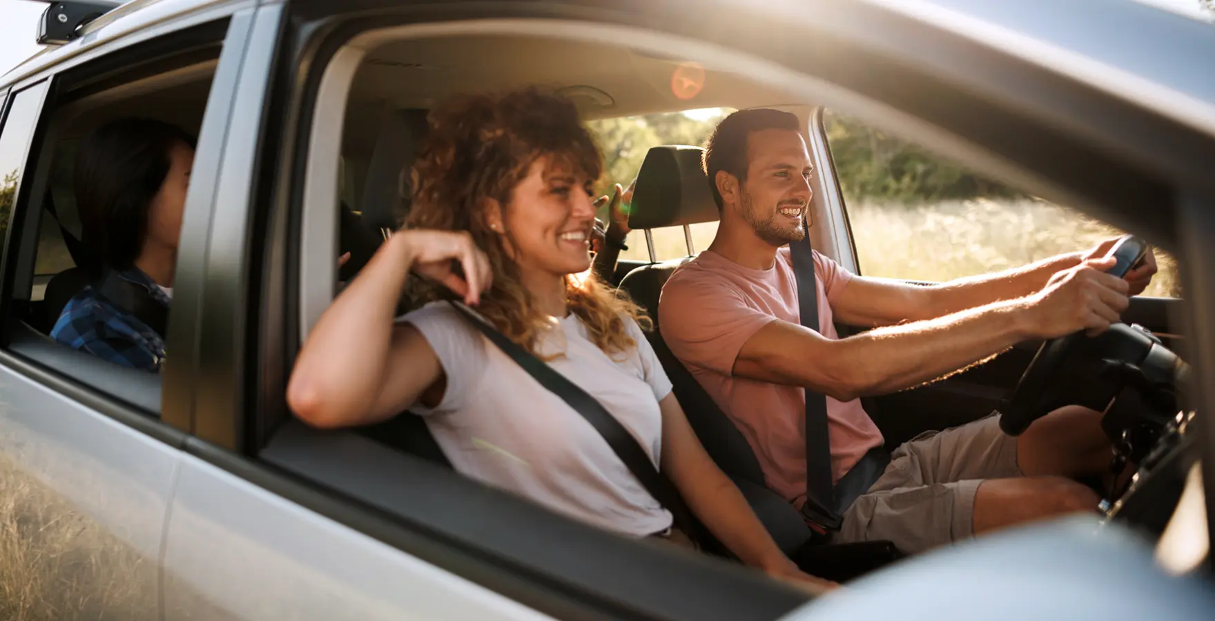 Man and woman driving in car