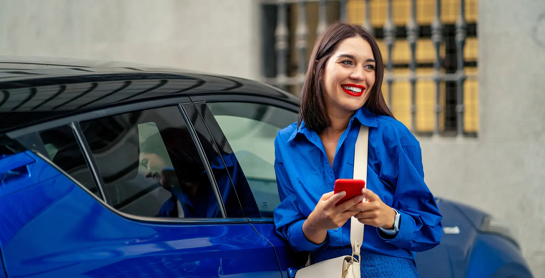 Woman standing by car