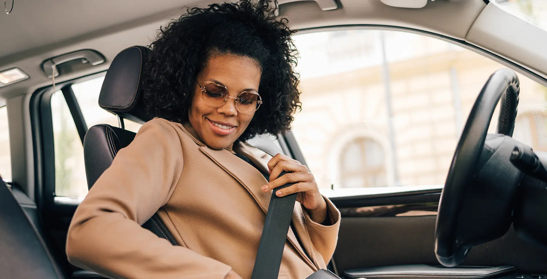 Woman buckling car seat