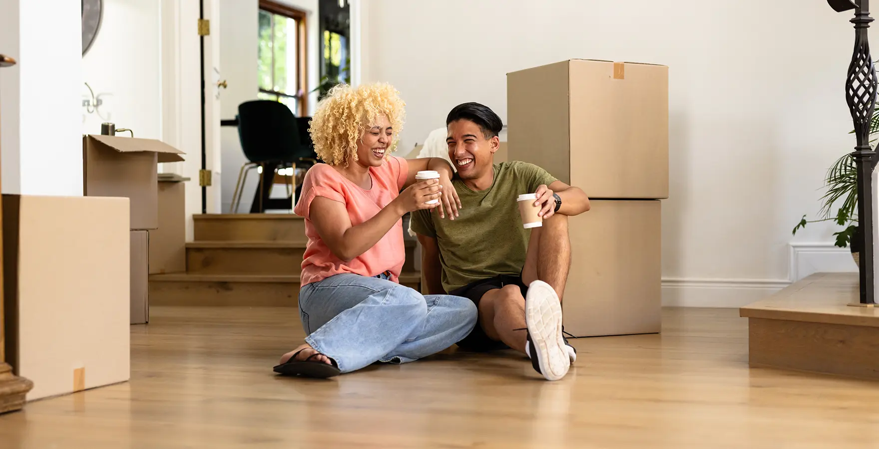 Man and woman sitting on floor