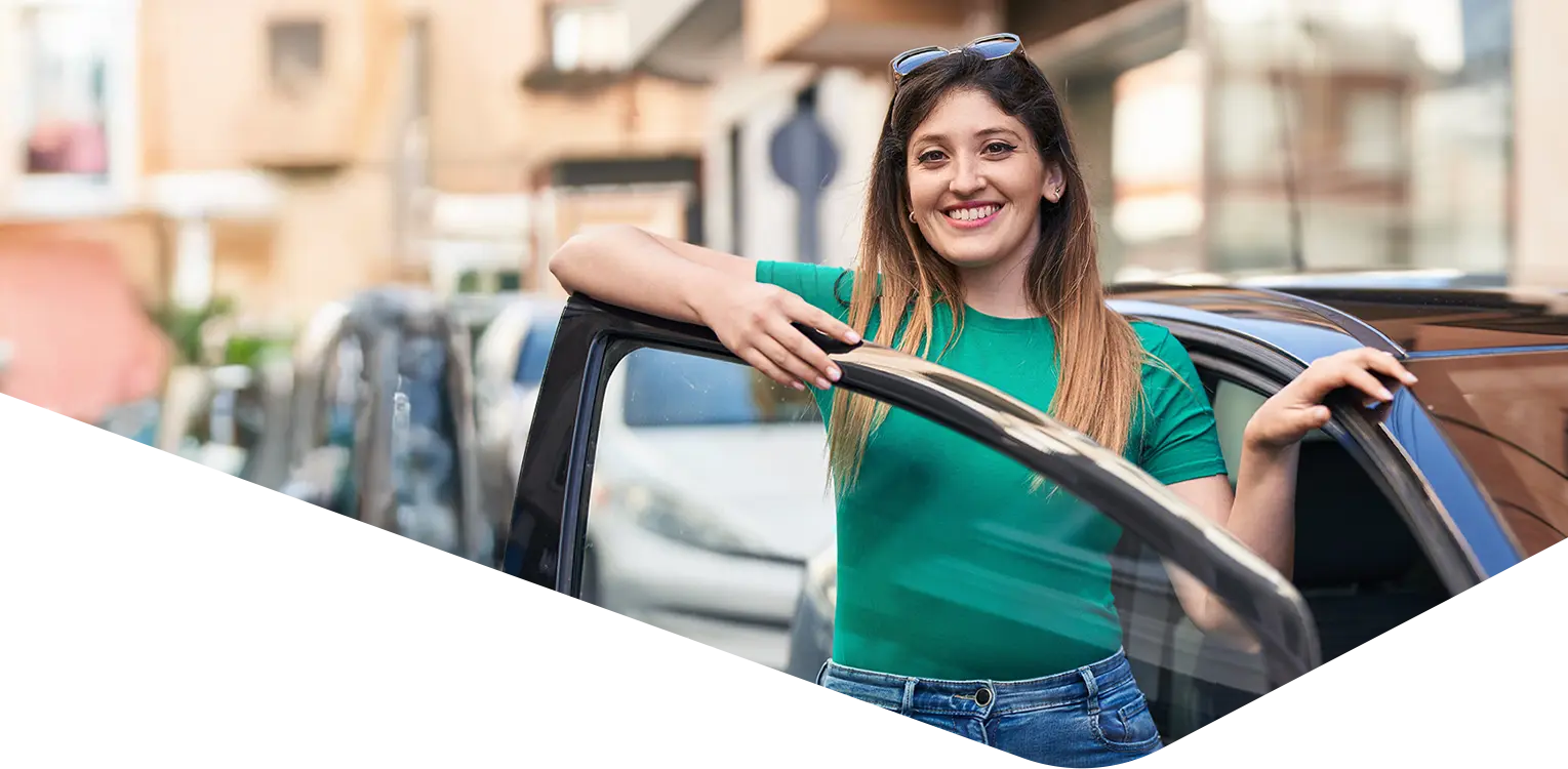 Woman standing by a car