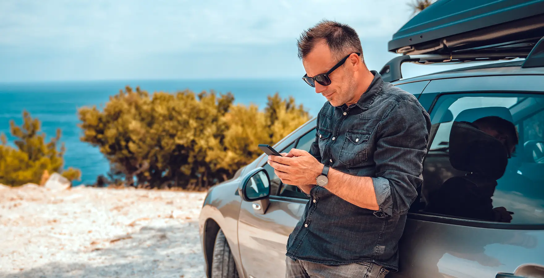 Man leaning on car